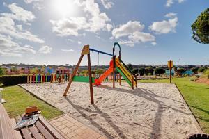 a playground with a slide in a park at Albufeira Paradise with Pool by Homing in Albufeira