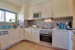 A kitchen or kitchenette at Albufeira Paradise with Pool by Homing