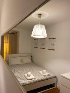Ein Bett oder Betten in einem Zimmer der Unterkunft COM•BRO Apartment