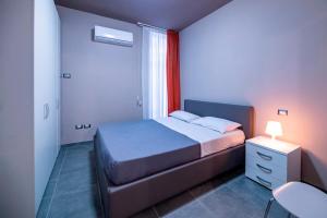 Postel nebo postele na pokoji v ubytování Eracle Hotel