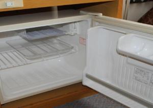 an empty refrigerator with its door open in a kitchen at skyhotel uozu / Vacation STAY 59597 in Uozu
