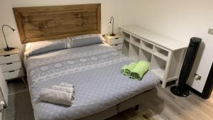 a bedroom with a bed with towels on it at Studio CENTRAL 2 in Aosta