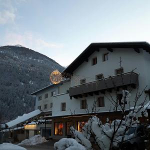 a large white building with snow on the ground at apart lobenwein in Pfunds