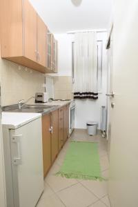 Η κουζίνα ή μικρή κουζίνα στο Zap apartman