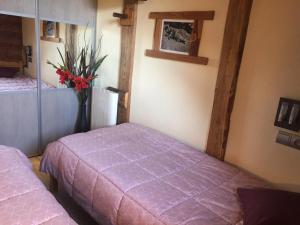 מיטה או מיטות בחדר ב-Le MAZOT chalet Lucie