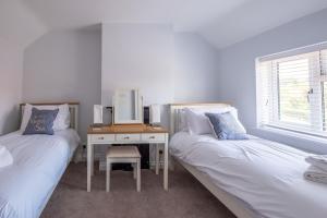 Ένα ή περισσότερα κρεβάτια σε δωμάτιο στο Pigwig Cottage, Thorpeness