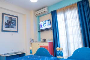 A television and/or entertainment centre at Yiannis Apartments