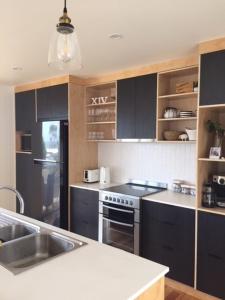 A kitchen or kitchenette at Beach House XIV
