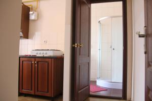 a bathroom with a shower and a sink and a tub at Apartments Domovik ,Kirilla i Mefodiya, 5 in Mukacheve +75 photos