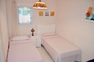 Postel nebo postele na pokoji v ubytování Apartamento Nuevo con Gran Terraza y Wifi en Canet