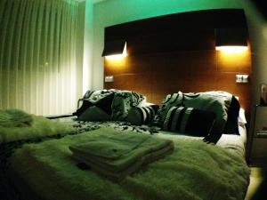 Voodi või voodid majutusasutuse Nap Oviedo toas