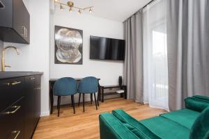 Televízia a/alebo spoločenská miestnosť v ubytovaní City of the Kings - Nubium Apartment