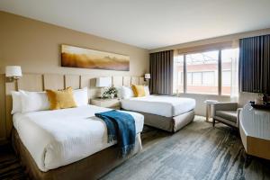 a hotel room with two beds and a window at Forest Park Hotel in Jasper +28 photos