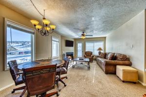 a living room with a table and a couch at Brianwood Condos in Brian Head