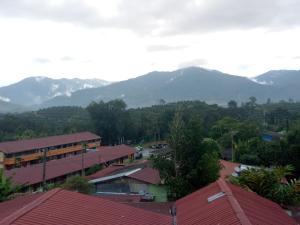 a view of a town with mountains in the background at A105 Homestay in Sungkai