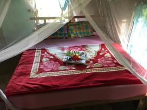 Un pat sau paturi într-o cameră la Lava View Tanna