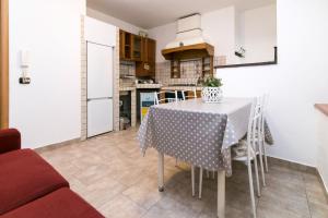 Kuchyň nebo kuchyňský kout v ubytování Conte Durini Apartments & Rooms