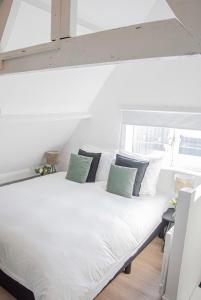 Postel nebo postele na pokoji v ubytování Tiny House Lindenhouse