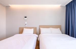 Postel nebo postele na pokoji v ubytování Hi Residences