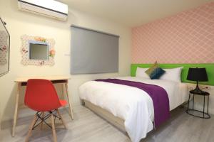 Postel nebo postele na pokoji v ubytování Guo Chen Hotel