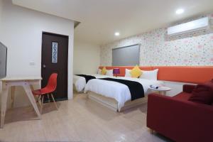 Postel nebo postele na pokoji v ubytování Guo Chen Hotel