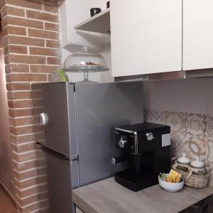 Kuchyň nebo kuchyňský kout v ubytování La casetta nel claustro