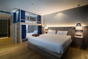 Ein Bett oder Betten in einem Zimmer der Unterkunft Baan Karon Resort