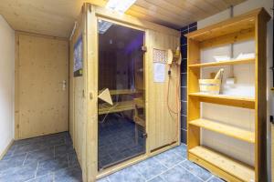 a small room with a door and a shelf at Cristallina II in Laax