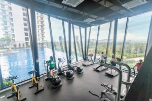 a gym with a view of the water in a building at Condo near Bukit Jalil by Idealhub in Kuala Lumpur