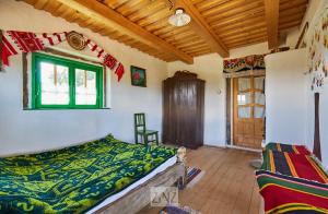 Postel nebo postele na pokoji v ubytování Casa Glod