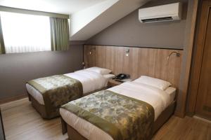 Ένα ή περισσότερα κρεβάτια σε δωμάτιο στο RADAR HOTEL +33 φωτογραφίες