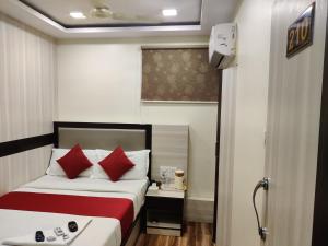 Postel nebo postele na pokoji v ubytování Hotel Happyland