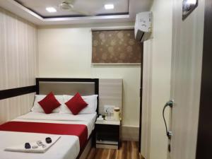 Postel nebo postele na pokoji v ubytování Hotel Happyland