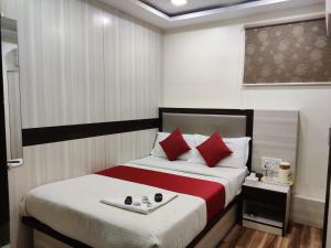 Postel nebo postele na pokoji v ubytování Hotel Happyland