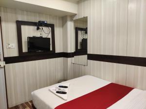 Postel nebo postele na pokoji v ubytování Hotel Happyland