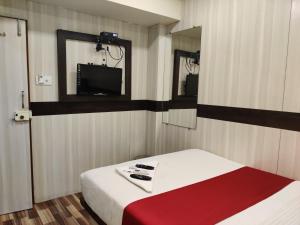 Postel nebo postele na pokoji v ubytování Hotel Happyland