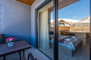 Voodi või voodid majutusasutuse New Gudauri Block 4, Gondola apartment toas