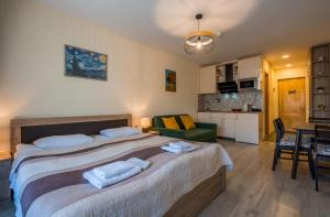 Voodi või voodid majutusasutuse New Gudauri Block 4, Gondola apartment toas