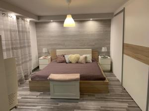 a bedroom with a bed with two pillows on it at Airport16 bed and breakfast in Budapest