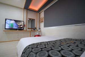 Postel nebo postele na pokoji v ubytování RG Pension + 37 fotografií