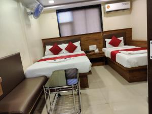 Postel nebo postele na pokoji v ubytování Hotel Happyland