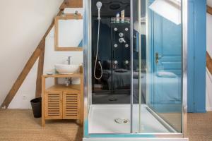 a glass shower in a bathroom with a sink at Le Pigeonnier, maison d'hôtes et Spa in Croix +107 photos