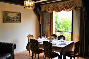 a dining room with a table with chairs and a window at Flat appartement 7 min from Paris Orly in Choisy-le-Roi