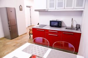 Kuchyň nebo kuchyňský kout v ubytování Stefania Apartment Centre