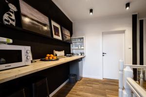 Kuchyňa alebo kuchynka v ubytovaní Apartamenty Koci Ogon