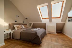 Posteľ alebo postele v izbe v ubytovaní Apartamenty Koci Ogon