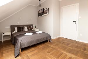 Posteľ alebo postele v izbe v ubytovaní Apartamenty Koci Ogon