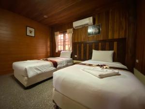 Postel nebo postele na pokoji v ubytování Yuwadee Resort + 37 fotografií