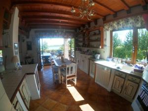 an overhead view of a kitchen with a table at Family Lake House in Mikołajki