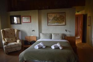 Een bed of bedden in een kamer bij Great Mantineia